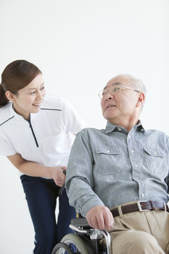 Female Nurse with Senior Male Patient