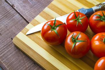 Tomatoes ready for salad, pictures of wonderful looking tomatoes
Tomatoes on knife and chopping board




