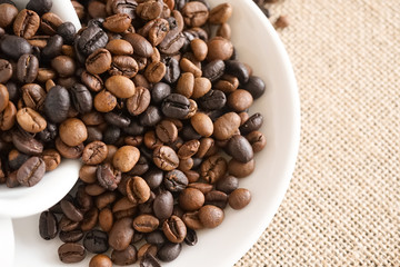 Coffee beans in a coffee cup, selective focus
