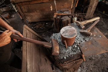 Blacksmith holding a hammer