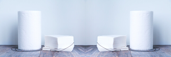 Paper tissue, paper towel and napkins on wooden background. Wide panoramic.