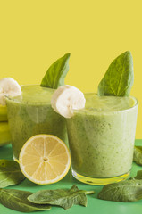 Fresh and healthy green smoothie with spinach,banana and lemon