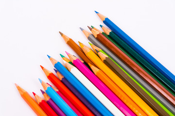 Colored pencils pattern isolated on white background
