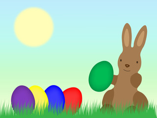 Osterhase mit Eiern auf einer Wiese