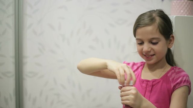 Little girl blows soap bubbles