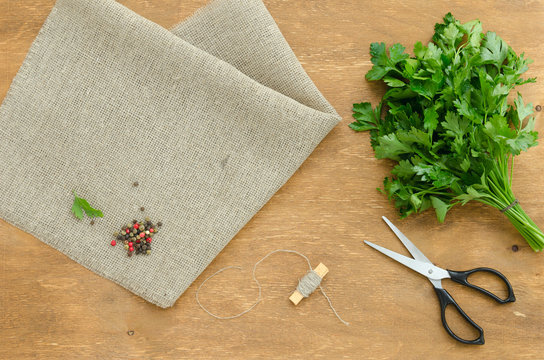 Bunch of parsley is on linen napkin