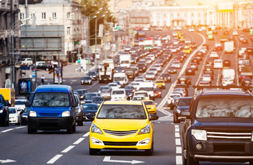 Yellow taxi on the traffic jam