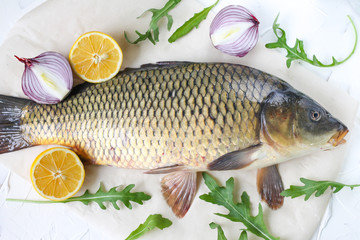  carp with lemon and tomato - fresh river fish