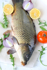 carp with lemon and tomato - fresh river fish