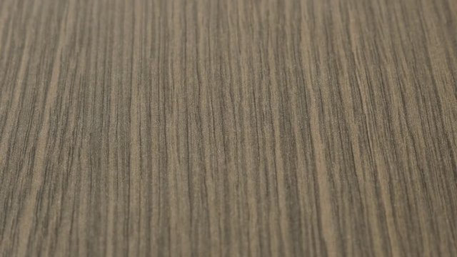 Texture of furniture wenge type material close-up slow tilt 4K 2160p 30fps UltraHD footage - Wood grain oak tree artificial surface 3840X2160 UHD tilting video