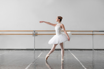 Female ballet dancer keep the rack in class