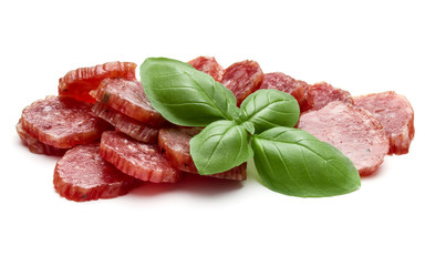 Salami smoked sausage slices and basil leaves isolated on white background cutout