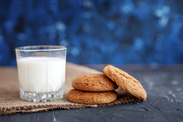 The glass of milk and tasty oatmeal cookies. The concept of healthy eating and vegetarianism.