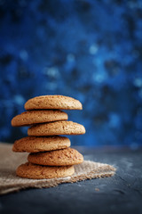 Fototapeta na wymiar Oatmeal cookies on sacking. Background. The concept of healthy eating and vegetarianism.