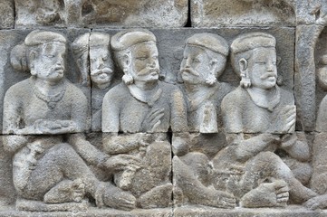 Detail of Buddhist carved relief in Borobudur temple in Yogyakarta, Java, Indonesia..