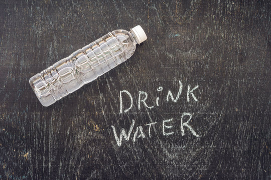 drink more water - hydration reminder - handwriting on On a chalk board