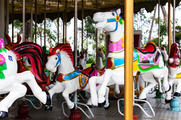 Fototapeta na wymiar Horses on a carnival merry go round
