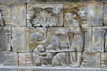 Detail of Buddhist carved relief in Borobudur temple in Yogyakarta, Java, Indonesia..