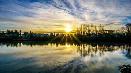 Sunset over Derby Reach and the Bedford Channel of the Fraser River near the historic town of Fort Langley in the middle of winter, in British Columbia