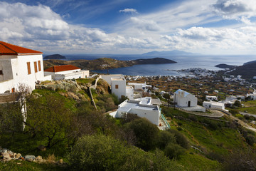 Fototapeta na wymiar View of the harbor, Livadi village and Sifnos island in the distance from Chora, Serifos island in Greece. 