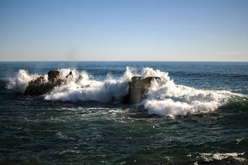 Waves hitting the rocks in Cascais, Portugal, near Lisbon