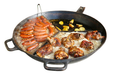 Fast street-food - smoked pork sausages, chicken legs  and stewed cabbage