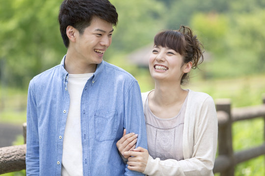 Couple folding arms and walking