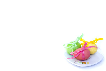 Easter egg with colored ribbons