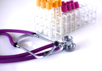stethoscope near medical tubes on white background