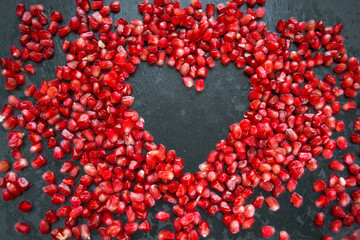 Pomegranate heart on a black background