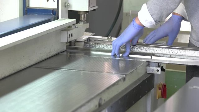 Hydraulic guillotine shear in action. Automated cutting machine. Sheet metal factory.