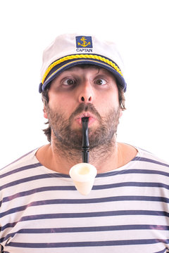 Crazy young sailor with smoking pipe