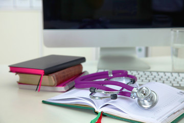 Stethoscope and computer on a desk in the office