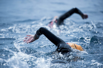 Group of unknown Swimmers at sea.