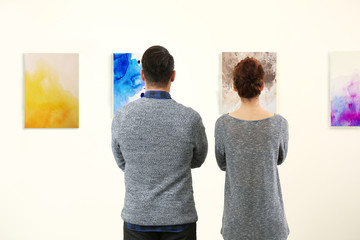 Young couple in modern art gallery
