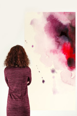 Young woman in modern art gallery