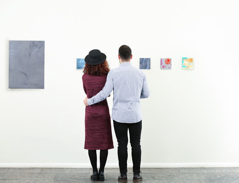 Young couple in modern art gallery