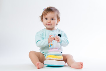 Portrait of a smiling child with a toy bear, isolated on a white background