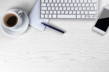 Workplace with cup of coffee and keyboard