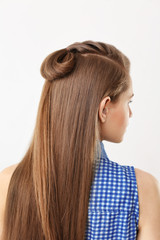 Naklejka premium Young beautiful woman with nice braid hairstyle on white background
