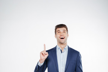 Happy Business man pointing and looking up