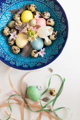 composition of ribbons and a Cretan bowl with Easter eggs