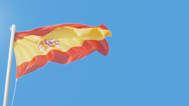 Spanish national flag against a blue sky