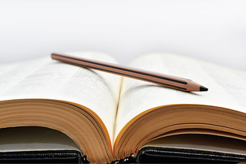 Old books with pencil.