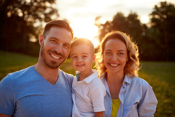 Smiling family together, portrait