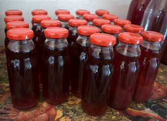 Juices made of natural grown raspberries with red blind plugs