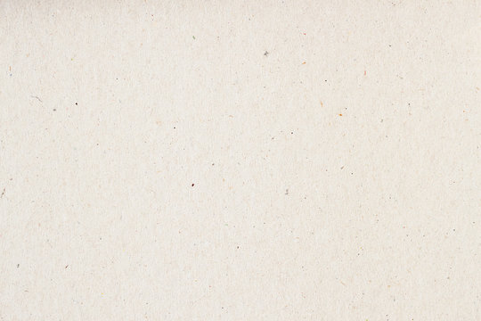 Texture of old organic light cream paper, background for design with copy space text or image. Recyclable material, has small inclusions of cellulose