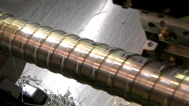 Lathe in action, closeup. Machine constructing metal part. Industry and cnc.