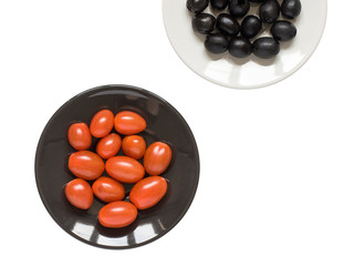 Two plates with tomatoes and olives