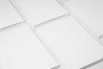Real paperback white books on a gray background